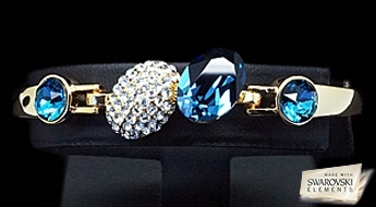 Яркий позолоченный браслет “Акрус” с кристаллами Swarovski Elements™ и Австрийскими фианитами.