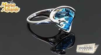 Позолоченное кольцо “Искусительница” с интересным дизайном и голубым кристаллом Swarovski Elements™.