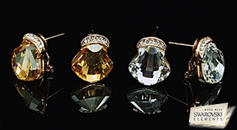 Сверкающие позолоченные сережки “Кристалина II” с красивыми кристаллами Swarovski Elements™ прозрачного цвета.