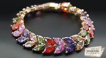 Красивый браслет “Селена II” с золотым покрытием и разноцветными кристаллами Swarovski Elements™.