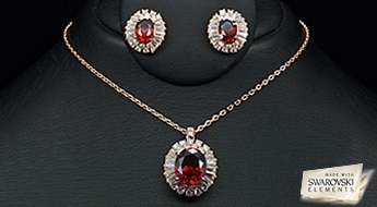 Стильный позолоченный комплект “Рубиновое Солнце” с ярким дизайном и Австрийскими кристаллами Swarovski Elements™ рубинового цвета.